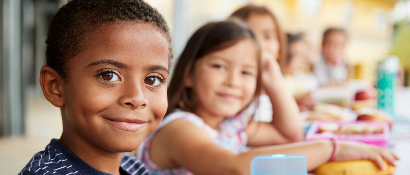 Children eating from lunchboxes