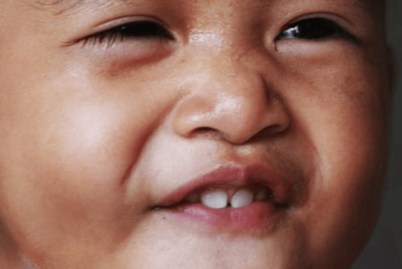 Young boy grinning