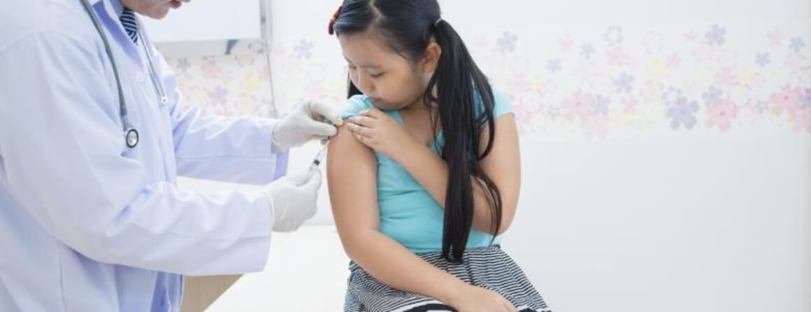 Young girl being vaccinated