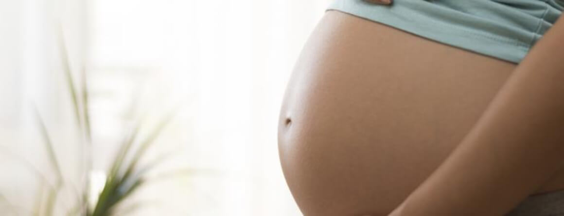 Exposed belly of a pregnant woman