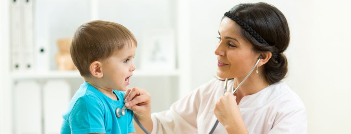 Doctor listening to child's heartbeat