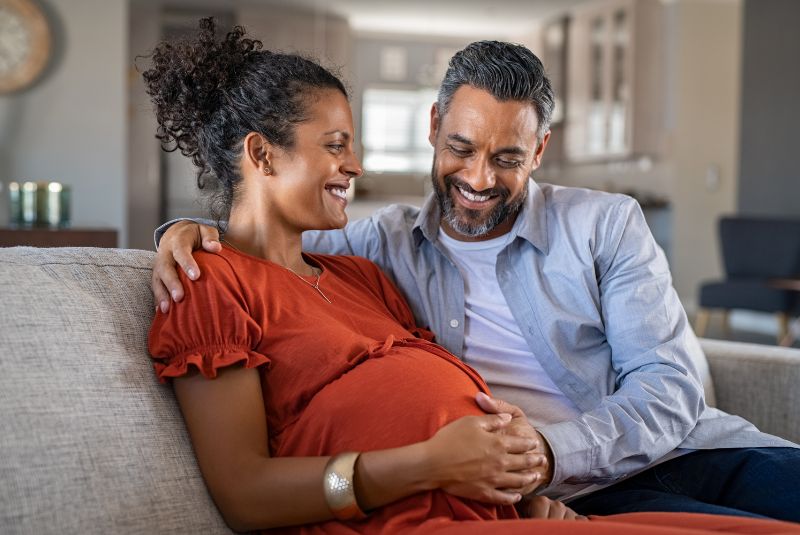 Pregnant couple smiling
