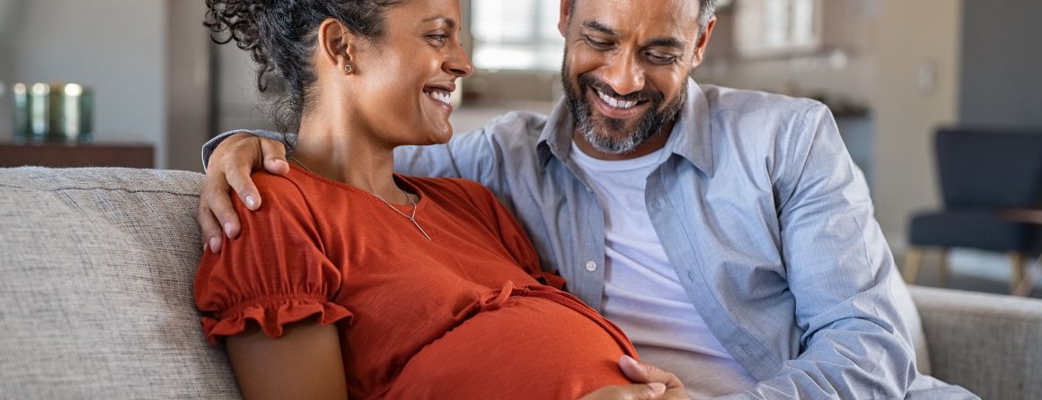 Pregnant couple smiling