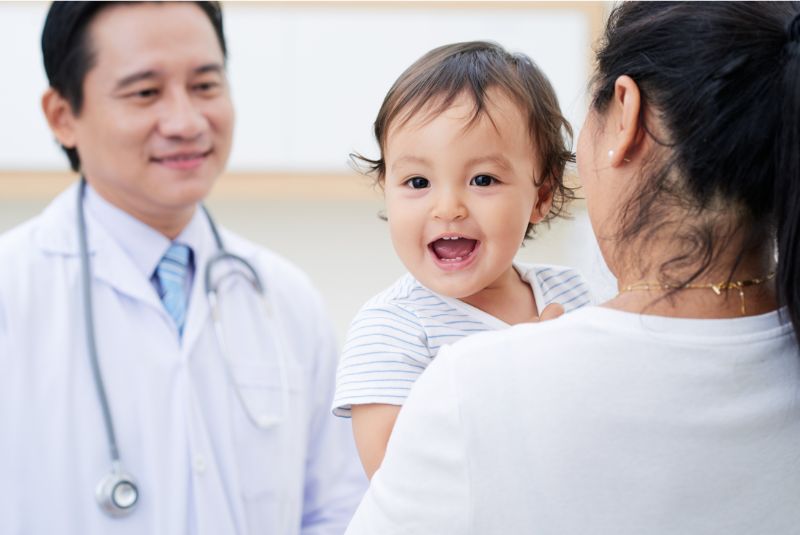 A child and mother are being seen by a doctor