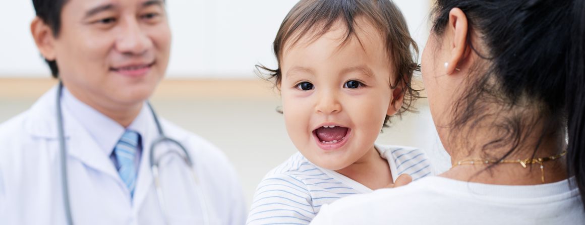 A child and mother are being seen by a doctor
