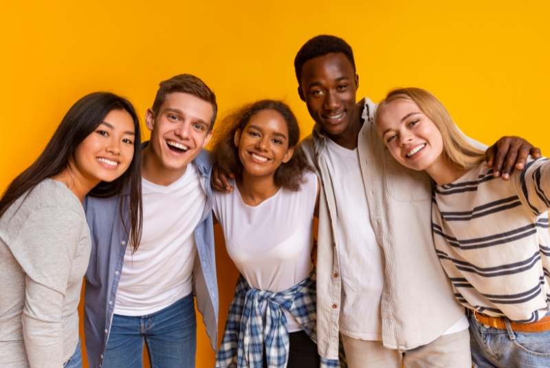 Adolescents smiling at camera