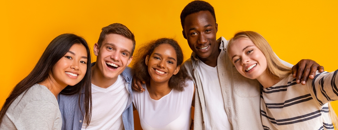 Adolescents smiling at camera
