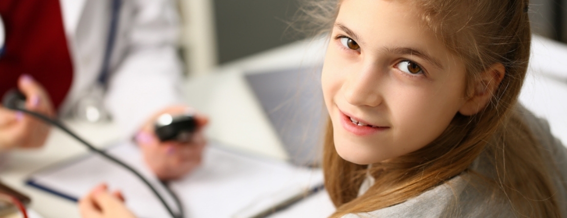 A child has a blood pressure check
