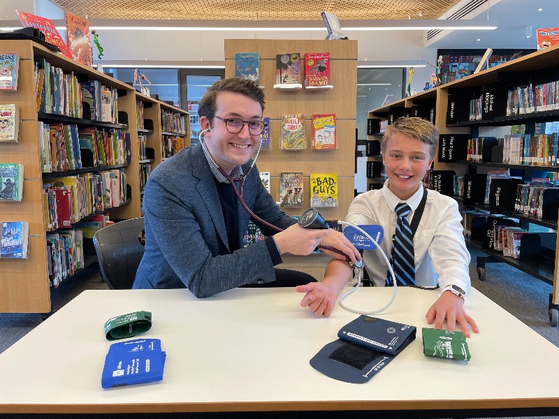 Jonathan Glenning takes the blood pressure of Christ Church Grammar student Louis.