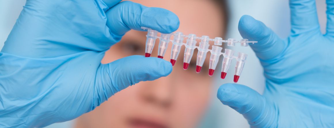 A researcher looking in vials