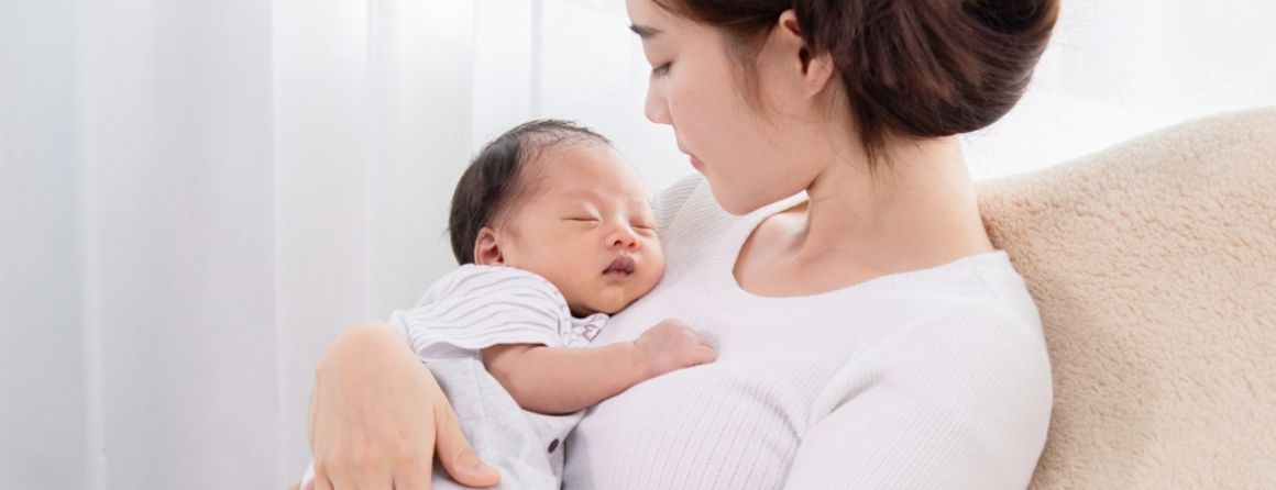 A mother holds her baby