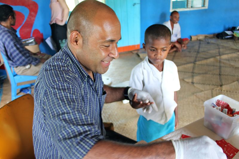 MCRI researcher giving child scabies treatment