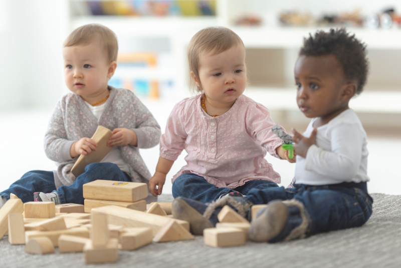 Toddlers playing with toys