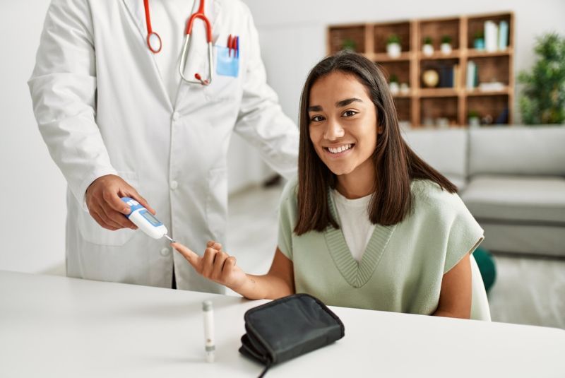 A diabetes patient receives a finger prick