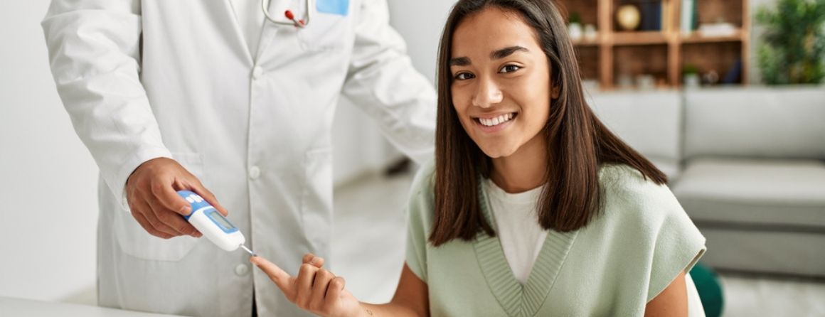 A diabetes patient receives a finger prick