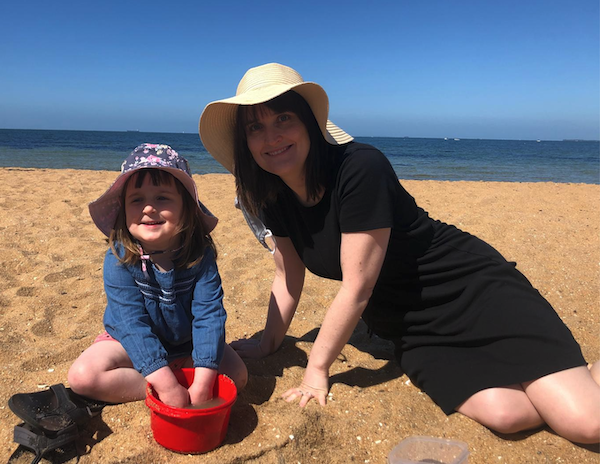 Mae at the beach with her mother