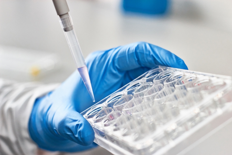 Scientist pipetting liquids for research