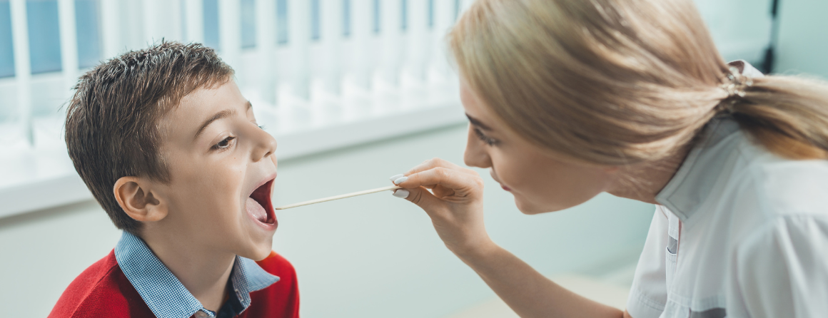 A child is checked for Strep A