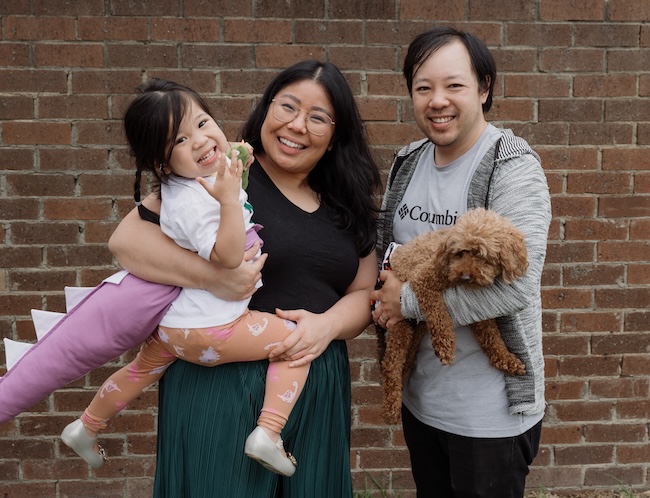 Emilia with her mum Vivienne, dad Viet and dog Atlas