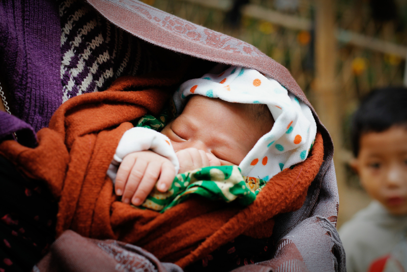 A child wrapped in blankets