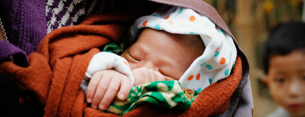 A child wrapped in blankets