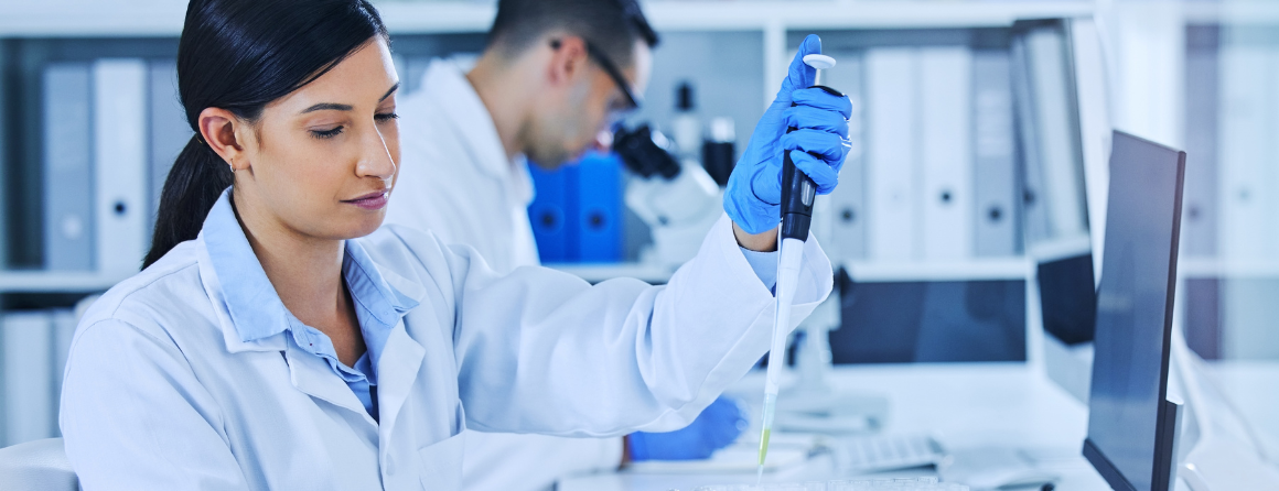 A scientist with a pipette