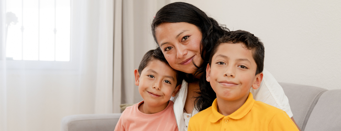 Mother and children smiling at camera