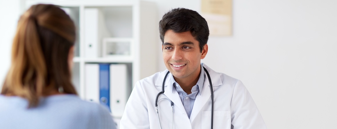 A doctor speaking to a patient