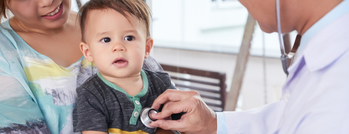 A child has their heart checked by a doctor