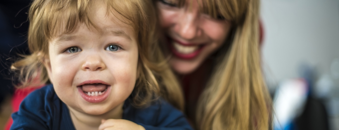 A child with achondroplasia and their mother