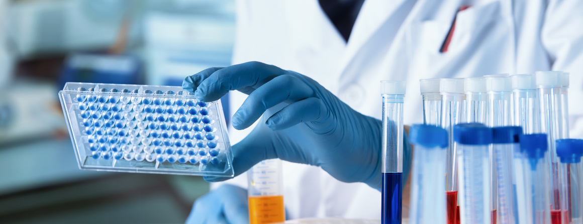 Scientist with pipettes in a lab