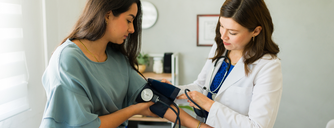 Woman getting blood pressure checked