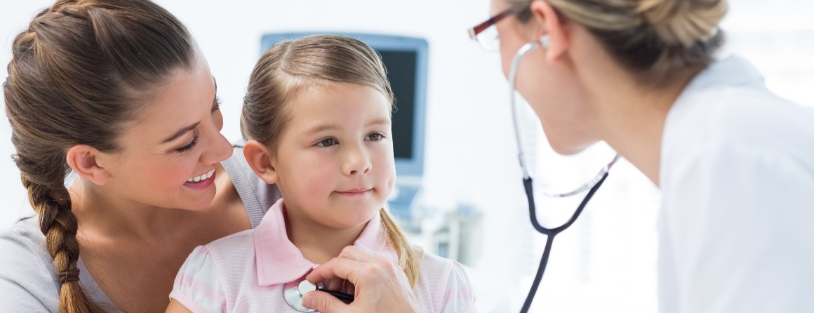 A young child at the doctors with parent. 