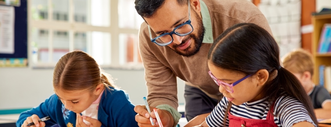 A teacher with two school children