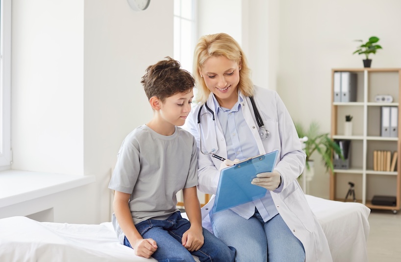 A child receives a mental health assessment from a doctor