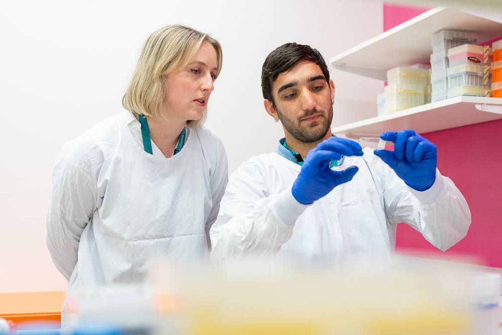 Lung Disease Research Assistant Jack Murphy looking at samples with Group Leader Dr Rhiannon Werder