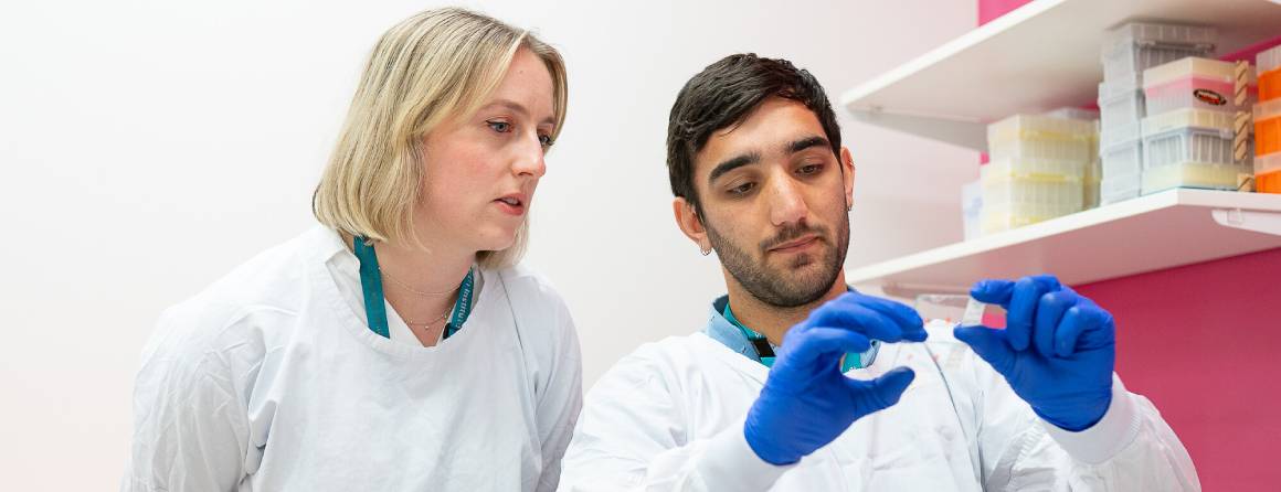 Lung Disease Research Assistant Jack Murphy looking at samples with Group Leader Dr Rhiannon Werder