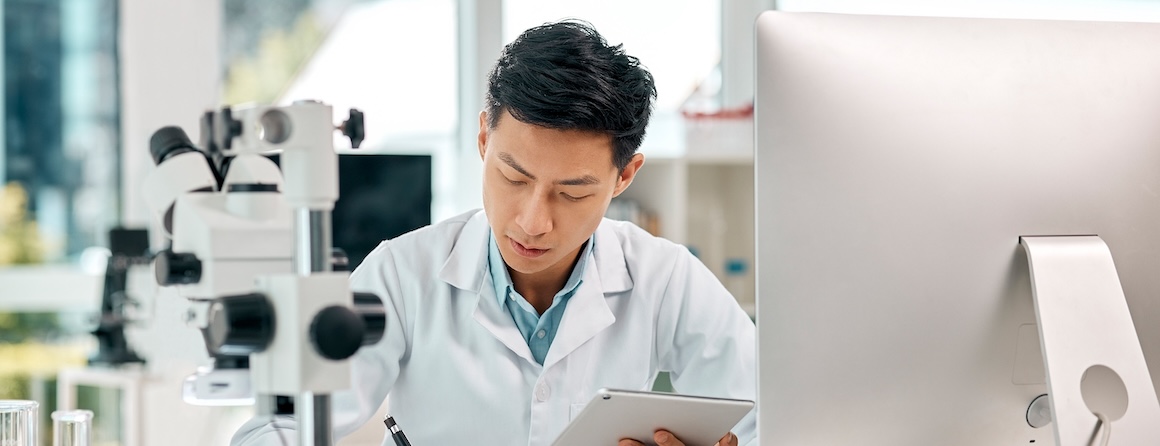 Researcher in lab with computer