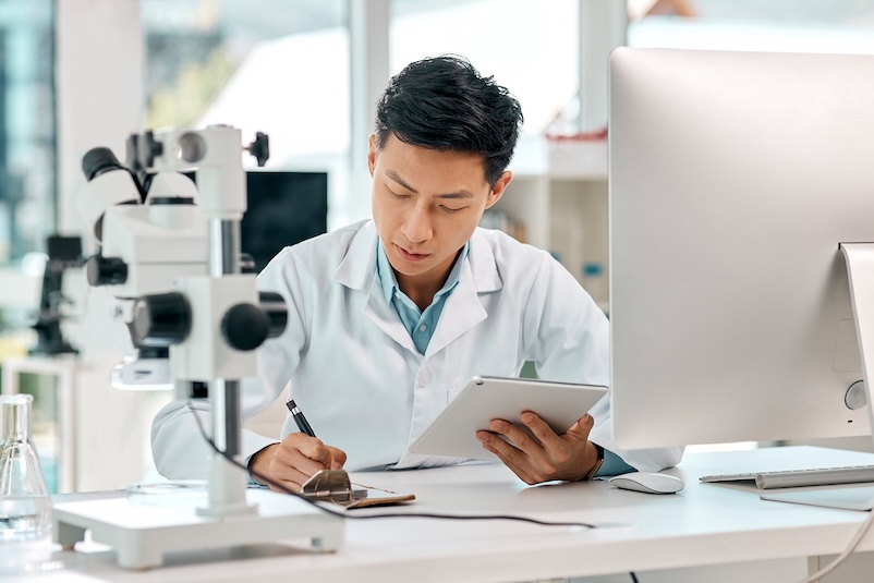 Researcher in lab with computer