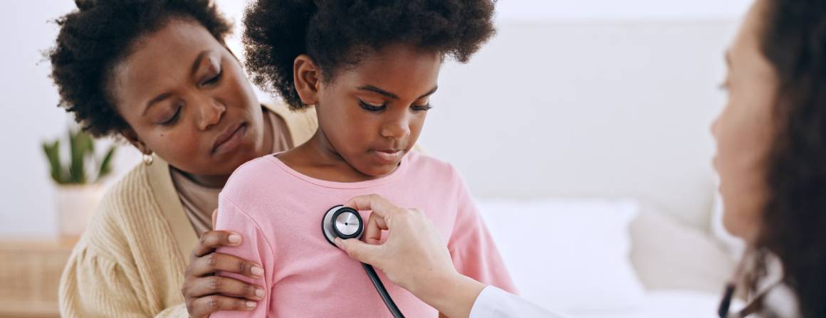 child at doctors with parent