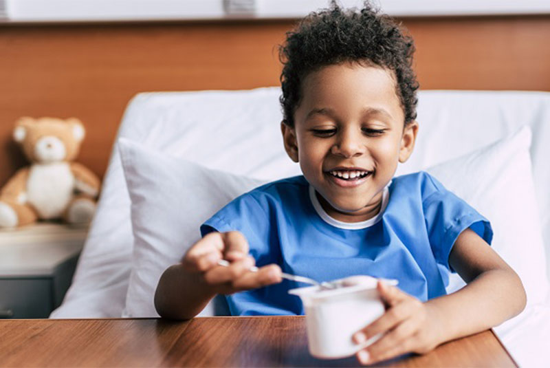 Boy eating yoghurt