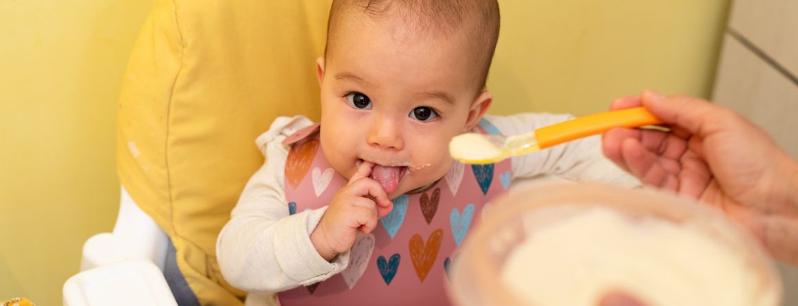 A baby being fed food