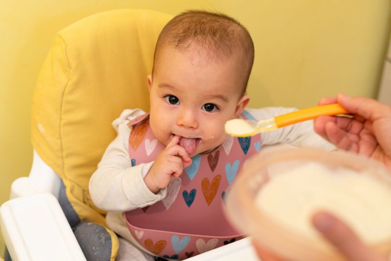 A baby being fed food