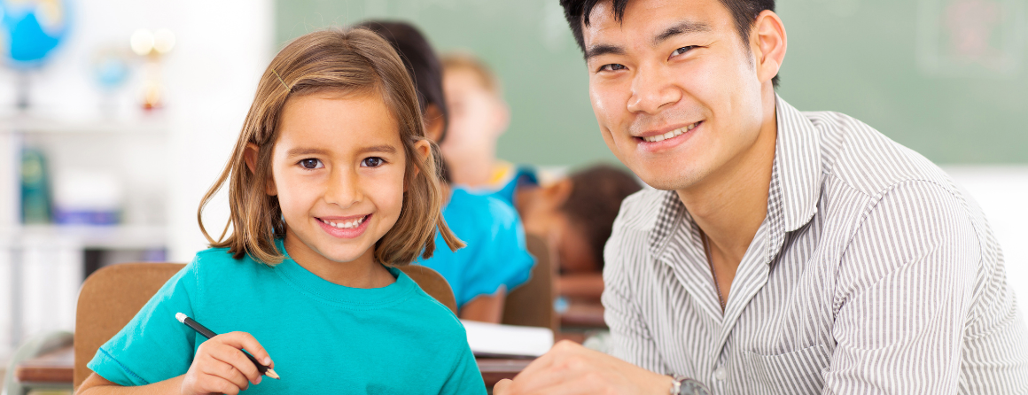 Happy student and teacher in a classroom