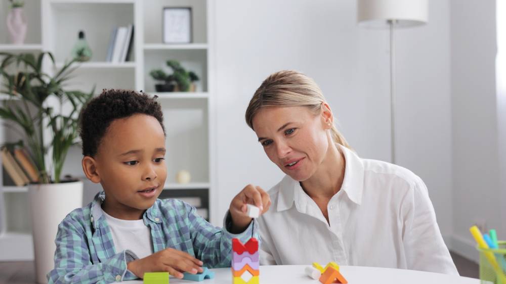 child with therapist