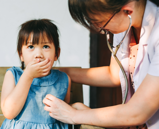 Doctor listening to child with asthma breathe