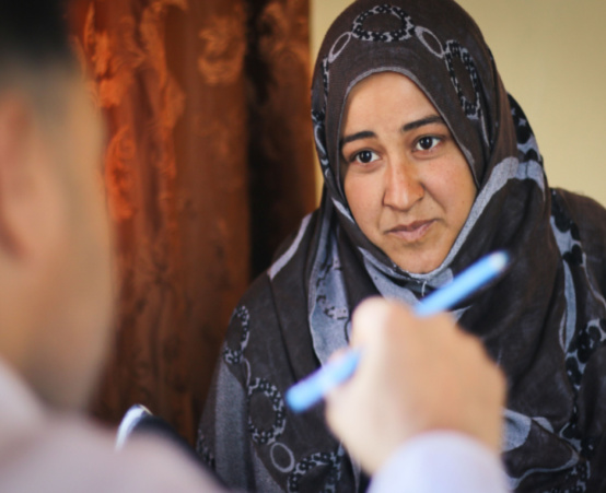Muslim lady speaking with a doctor