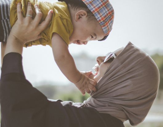 Refugee woman and young child