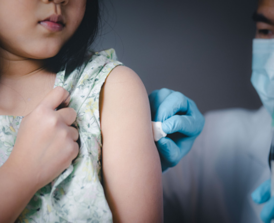 Little girl getting an injection