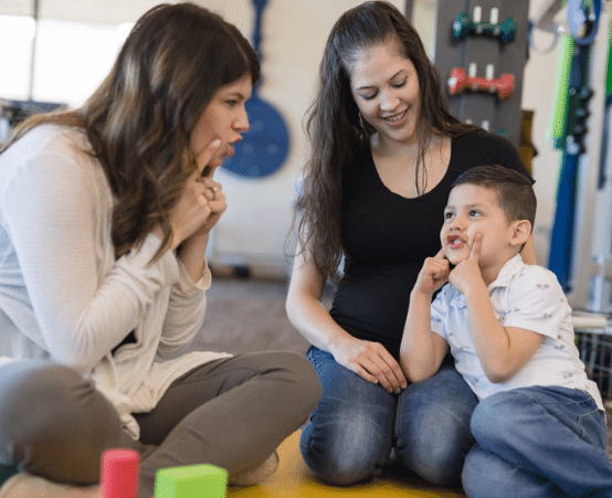 Young boy learning speech and language techniques